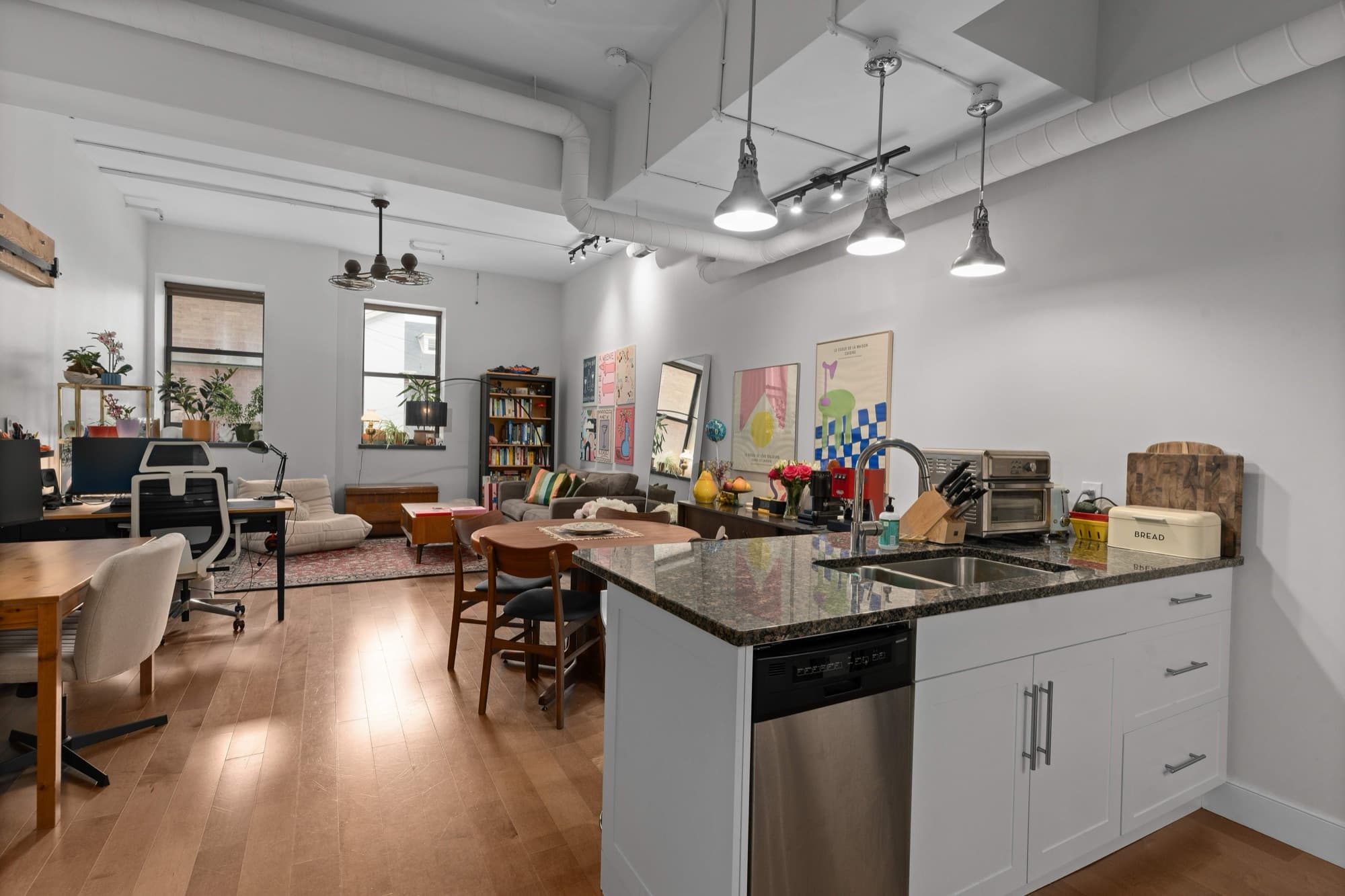 Open-plan living, dining and kitchen in a 265 Princess Street apartment